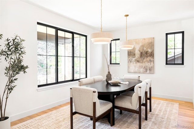 1680 S Humboldt St, Denver, CO 80210 - dining room featuring light wood-type flooring and baseboards
