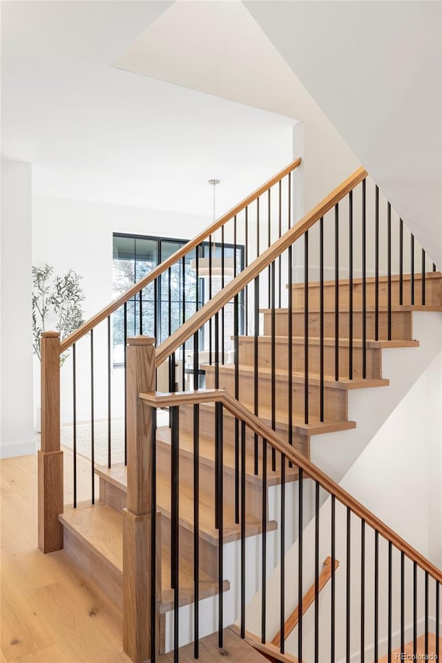 1680 S Humboldt St, Denver, CO 80210 - staircase featuring wood finished floors