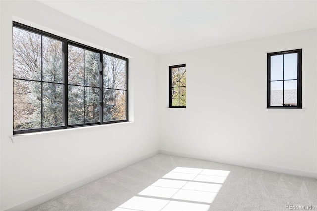 1680 S Humboldt St, Denver, CO 80210 - carpeted spare room featuring baseboards