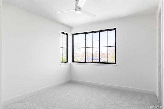1680 S Humboldt St, Denver, CO 80210 - empty room featuring light colored carpet, baseboards, and a ceiling fan