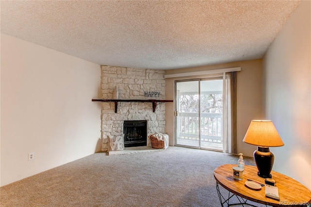 unfurnished living room with carpet, a textured ceiling, and a stone fireplace