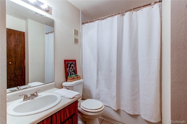 full bathroom featuring vanity, toilet, and shower / bath combo with shower curtain