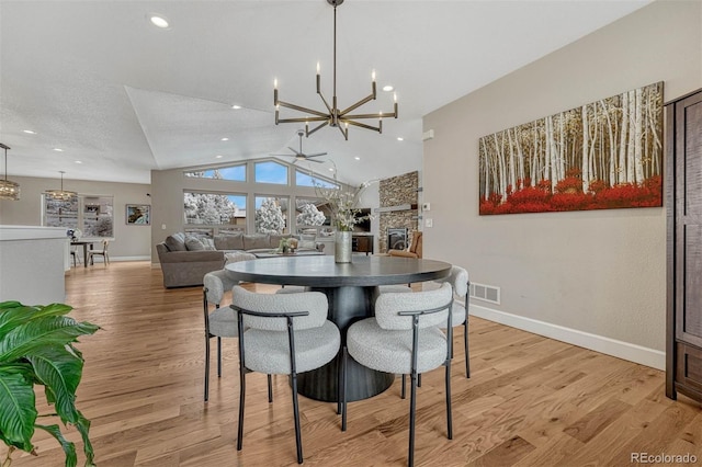 dining room with light wood-type flooring, baseboards, visible vents, and recessed lighting