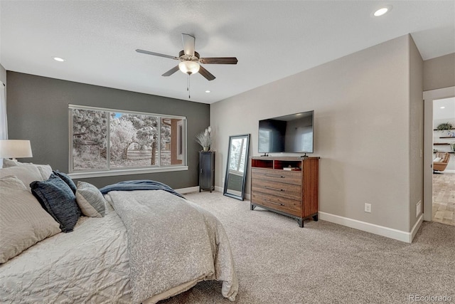 bedroom featuring recessed lighting, baseboards, a ceiling fan, and light colored carpet