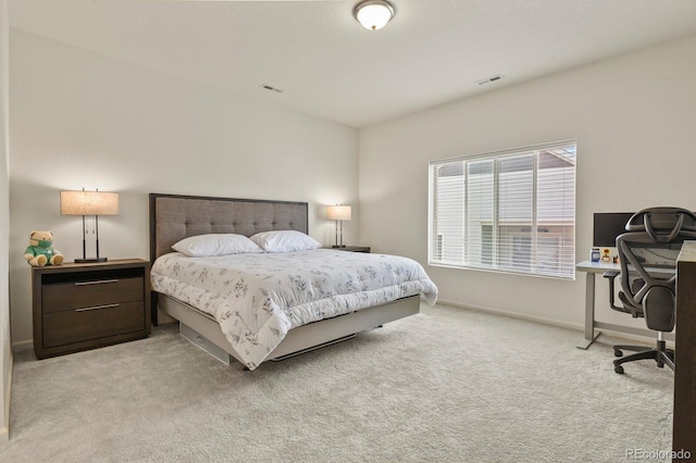 bedroom featuring baseboards, visible vents, and carpet