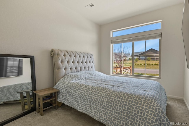 carpeted bedroom with visible vents