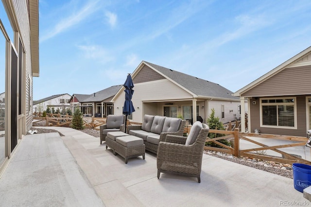 view of patio with fence and outdoor lounge area