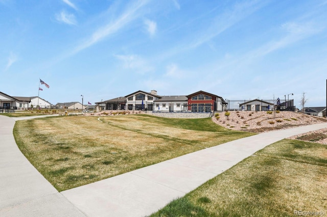 view of home's community with a lawn