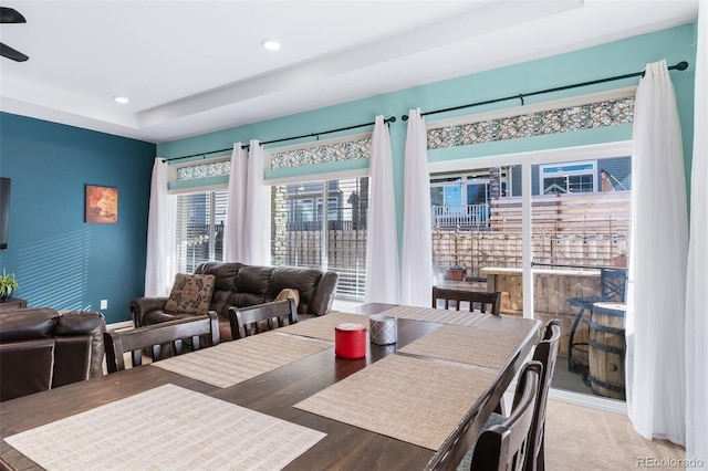 dining space with a tray ceiling