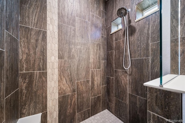 bathroom with tiled shower