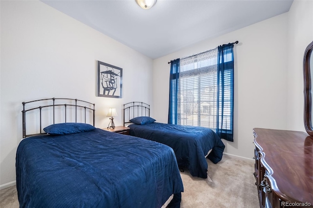 bedroom with light colored carpet