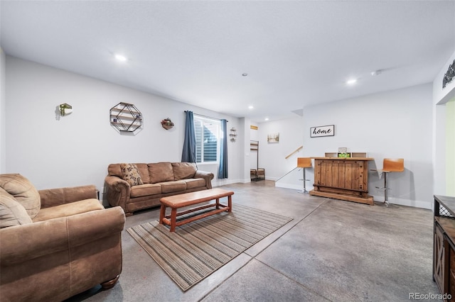 living room featuring concrete flooring