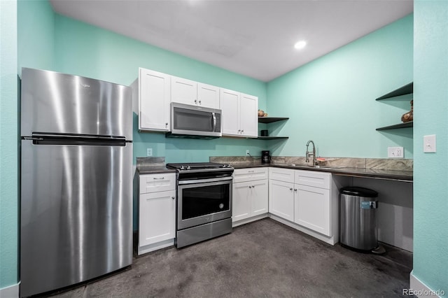 kitchen featuring white cabinetry, appliances with stainless steel finishes, and sink