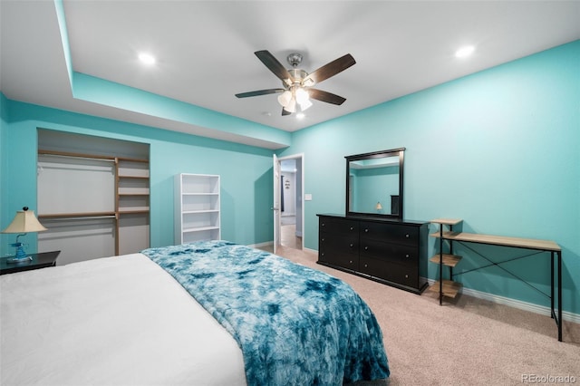 bedroom with a closet, ceiling fan, and carpet