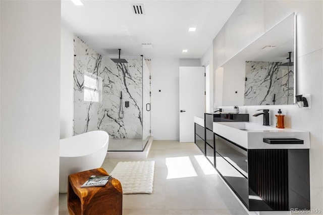 bathroom featuring vanity, plus walk in shower, and tile walls