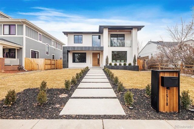 contemporary home featuring a front yard