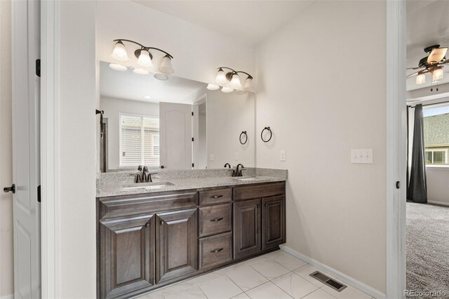 6514 Agave Ave, Castle Rock, CO 80108 - bathroom featuring baseboards, double vanity, a sink, and visible vents