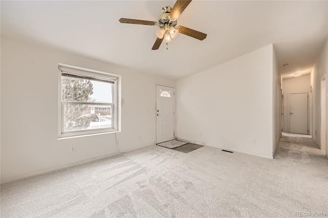 unfurnished room with light carpet, ceiling fan, and visible vents