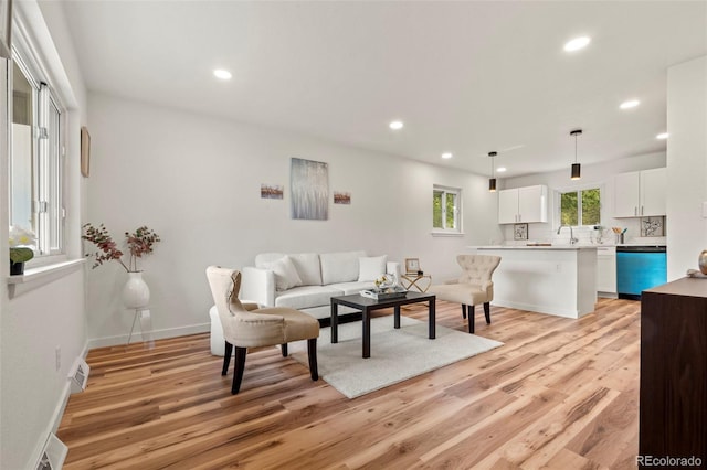 871 S Worchester St, Aurora, CO 80012 - living room with light wood-type flooring and recessed lighting