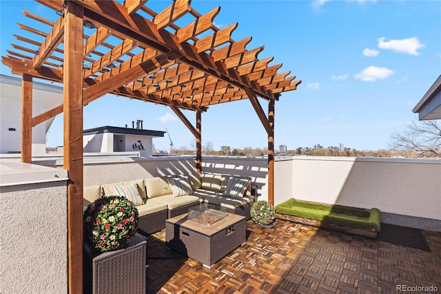 view of patio featuring an outdoor living space with a fire pit and a pergola
