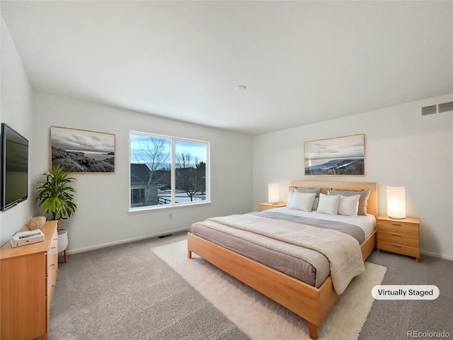 bedroom featuring light carpet, baseboards, and visible vents