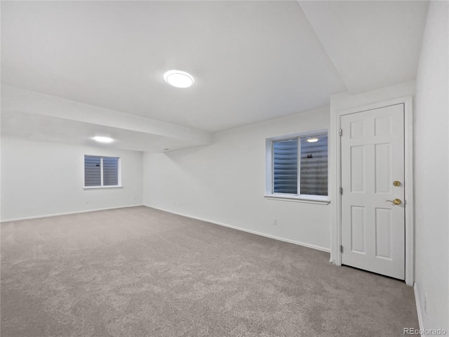 carpeted spare room featuring visible vents and baseboards