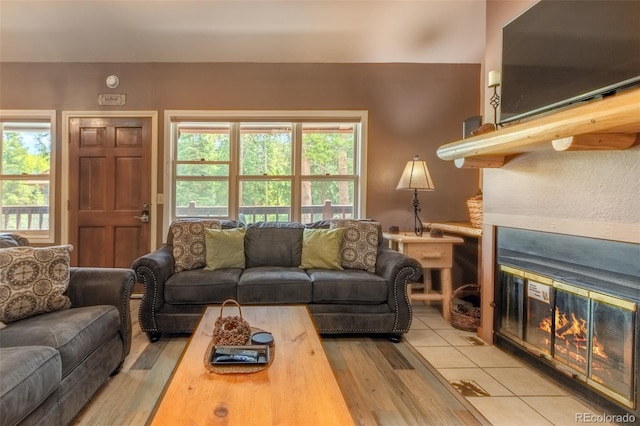 220 Rapids Ln Unit 4, Grand Lake, CO 80447 - living area featuring wood finished floors and a fireplace with flush hearth