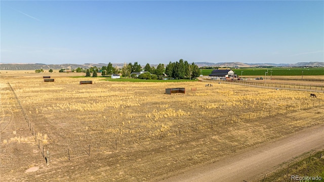 exterior space featuring a rural view and a mountain view