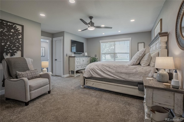 bedroom featuring ensuite bathroom, ceiling fan, and carpet