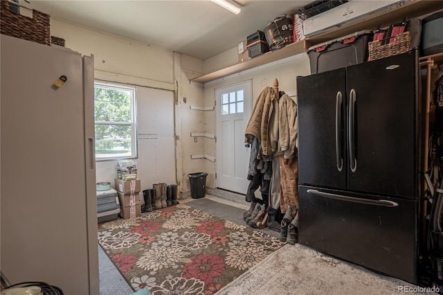 kitchen featuring black refrigerator and white refrigerator