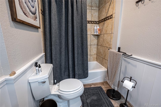 bathroom featuring toilet and shower / bathtub combination with curtain