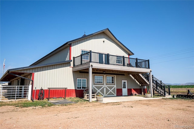 back of property with an outbuilding