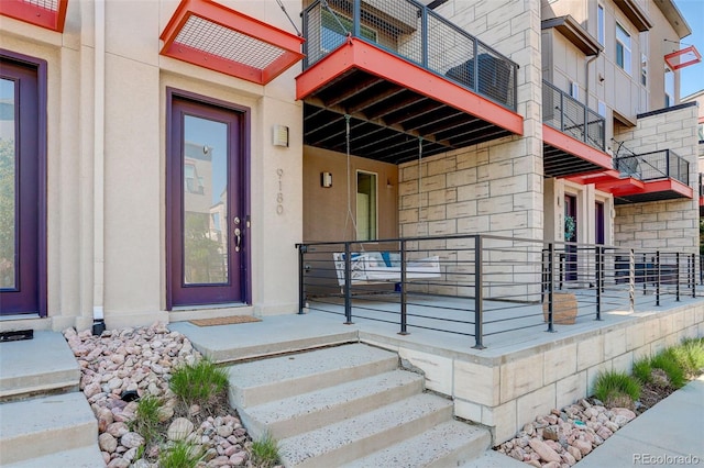 9180 E 52nd Dr, Denver, CO 80238 - property entrance featuring stone siding and stucco siding