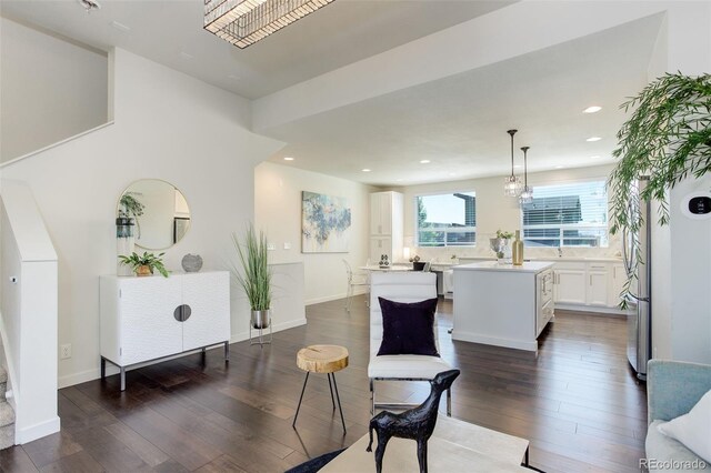 9180 E 52nd Dr, Denver, CO 80238 - living area featuring dark wood-style floors and recessed lighting