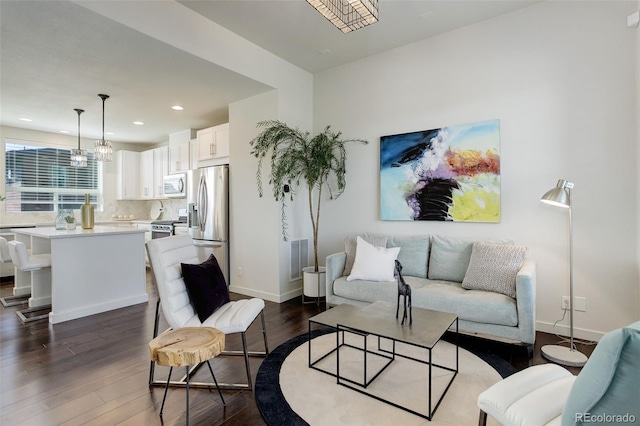 9180 E 52nd Dr, Denver, CO 80238 - living room featuring dark wood finished floors and recessed lighting