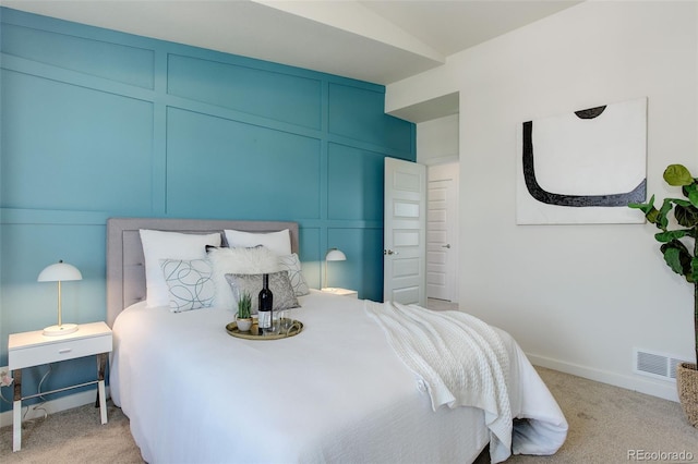 9180 E 52nd Dr, Denver, CO 80238 - bedroom featuring light carpet and a decorative wall