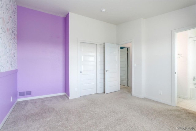 9180 E 52nd Dr, Denver, CO 80238 - unfurnished bedroom with carpet, a closet, and connected bathroom