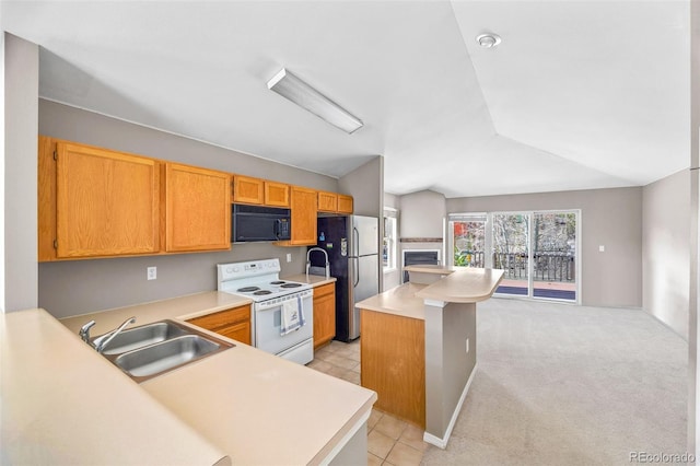 10 River Park Dr Unit A, Breckenridge, CO 80424 - kitchen with electric stove, black microwave, a sink, freestanding refrigerator, and lofted ceiling