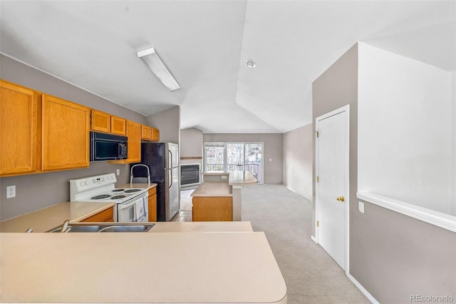 10 River Park Dr Unit A, Breckenridge, CO 80424 - kitchen featuring white range with electric stovetop, black microwave, freestanding refrigerator, vaulted ceiling, and light colored carpet