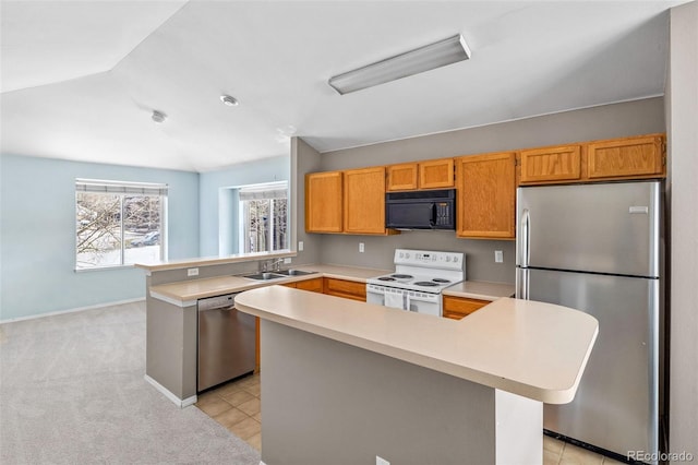 10 River Park Dr Unit A, Breckenridge, CO 80424 - kitchen with stainless steel appliances, light countertops, a peninsula, a sink, and vaulted ceiling