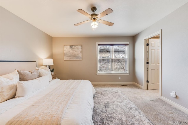 bedroom with baseboards, carpet floors, and a ceiling fan