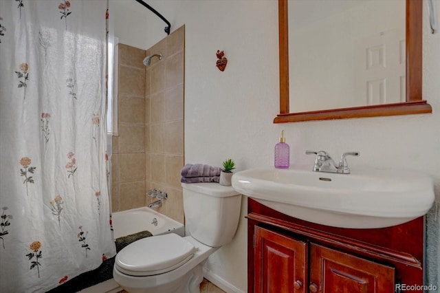 full bathroom featuring vanity, shower / bath combination with curtain, and toilet