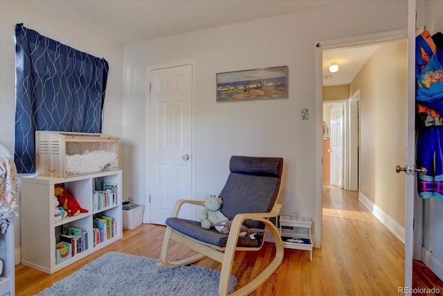 sitting room featuring light wood-type flooring