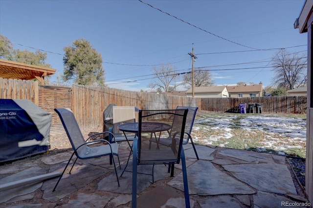 view of patio featuring a grill