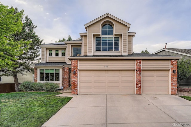455 Bexley St, Littleton, CO 80126 - view of front of house with concrete driveway, a front lawn, a garage, brick siding, and a shingled roof