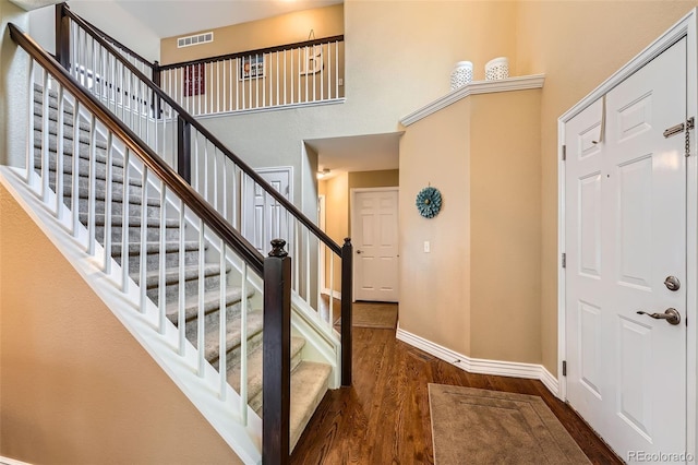 455 Bexley St, Littleton, CO 80126 - foyer entrance with wood finished floors, a high ceiling, and stairway