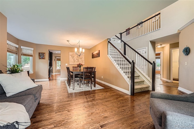 455 Bexley St, Littleton, CO 80126 - living area with a chandelier, stairs, and wood finished floors