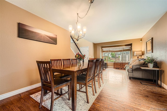 455 Bexley St, Littleton, CO 80126 - dining space featuring wood finished floors and a chandelier