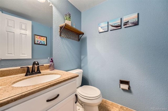 455 Bexley St, Littleton, CO 80126 - bathroom featuring vanity and a textured wall