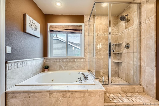 455 Bexley St, Littleton, CO 80126 - full bath featuring a stall shower, a garden tub, and a textured wall